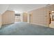 Bedroom showcasing wallpaper, plush blue carpeting, and a window seat for added comfort and charm at 1585 Lazy River Ln, Sandy Springs, GA 30350