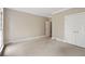 Empty bedroom with carpet, neutral walls, closet, and natural light at 1585 Lazy River Ln, Sandy Springs, GA 30350