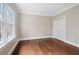 Bright bedroom with hardwood floors, window and closet; perfect for relaxing or setting up an office at 1585 Lazy River Ln, Sandy Springs, GA 30350