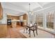 Open kitchen and dining area featuring tile floors, wood cabinets, and a view to the back deck at 1585 Lazy River Ln, Sandy Springs, GA 30350