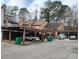 Carport area with several parking spaces and vehicles at 43 Willowick Ct, Stonecrest, GA 30038