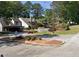 Exterior shot of the property, including signage and landscaping at 43 Willowick Ct, Stonecrest, GA 30038