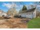 A three-car garage in the front of the property with a driveway at 75 Price W Dr, Locust Grove, GA 30248