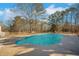 Backyard pool with a concrete surround at 75 Price W Dr, Locust Grove, GA 30248