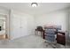 Home office features gray carpet, a desk with three monitors, and a storage cabinet at 1110 Croftmoore Lndg, Suwanee, GA 30024