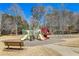 View of a community playground with slides and swings at 1110 Croftmoore Lndg, Suwanee, GA 30024