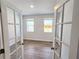 Bright office space with wood flooring and glass paneled double doors at 2389 Brown Dove Way (5), Grayson, GA 30017