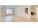 Spacious basement room with ample natural light and neutral-toned walls, tiled hallway at 589 Cook Dr, Ellenwood, GA 30294