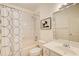 Clean bathroom featuring a shower-tub combo, vanity with sink, and patterned shower curtain at 589 Cook Dr, Ellenwood, GA 30294