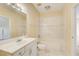 Cozy bathroom boasting tiled walls, a shower-tub combo, and a sink with white cabinets at 589 Cook Dr, Ellenwood, GA 30294