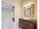 Bathroom view from the door shows the vanity, mirror, tile floor, and bedroom at 589 Cook Dr, Ellenwood, GA 30294