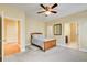 Comfortable bedroom with a ceiling fan, doorway access to ensuite bath, and ample space for furnishings at 589 Cook Dr, Ellenwood, GA 30294