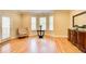 Inviting seating area with wood floors and a view of the outdoor balcony at 589 Cook Dr, Ellenwood, GA 30294
