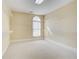 Spacious walk-in closet with carpet flooring, a window, and wire shelving for organized storage at 589 Cook Dr, Ellenwood, GA 30294