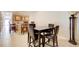 A dining area with a wooden table and chairs adjacent to a bar in a well-lit room at 589 Cook Dr, Ellenwood, GA 30294
