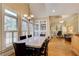 Dining room with hardwood floors, a large window, and views of the living room at 589 Cook Dr, Ellenwood, GA 30294