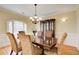 Formal dining room with a large wooden table, ornate chairs, and a china cabinet at 589 Cook Dr, Ellenwood, GA 30294