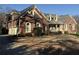 Charming brick home featuring a well-manicured lawn and a two-car garage at 589 Cook Dr, Ellenwood, GA 30294