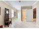 Bright hallway with tiled floors, leading to a bathroom and other rooms at 589 Cook Dr, Ellenwood, GA 30294