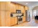 Bright kitchen featuring stainless steel appliances, light wood cabinetry and hardwood floors at 589 Cook Dr, Ellenwood, GA 30294