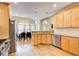 Updated kitchen with wood cabinets, granite countertops, stainless steel appliances, and hardwood floors at 589 Cook Dr, Ellenwood, GA 30294