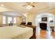 An extravagant main bedroom with hardwood floors and an additional seating area at 589 Cook Dr, Ellenwood, GA 30294