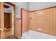 Tiled bathroom with a shower and a tub at 1678 Capistrana Pl, Decatur, GA 30032