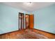 Bedroom with light blue walls and wood floors at 1678 Capistrana Pl, Decatur, GA 30032