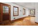 Living room with wood floors, and a decorative glass inset on the front door at 1678 Capistrana Pl, Decatur, GA 30032