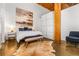 Bedroom featuring polished concrete floor, white walls, and a large picture window at 170 Boulevard Se # H416, Atlanta, GA 30312