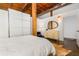 Bright bedroom with polished concrete floor, wood ceiling, and stylish dresser at 170 Boulevard Se # H416, Atlanta, GA 30312