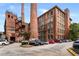 Renovated brick mill with two smokestacks converted into apartments with parking and green space at 170 Boulevard Se # H416, Atlanta, GA 30312