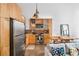 Stylish kitchen featuring wooden cabinets, stainless steel appliances, and exposed ceiling beams at 170 Boulevard Se # H416, Atlanta, GA 30312