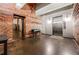 Industrial-chic lobby with exposed brick, polished concrete floors, elevator, and access to common areas at 170 Boulevard Se # H416, Atlanta, GA 30312