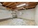 Unfinished basement with a concrete floor, overhead lighting, and an exposed ceiling at 2142 Graystone Pkwy, Grayson, GA 30017