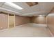 Unfinished basement with concrete floors and walls, offering potential for customization and additional living space at 2142 Graystone Pkwy, Grayson, GA 30017