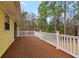 Large wooden deck with white railing overlooking the private backyard at 2142 Graystone Pkwy, Grayson, GA 30017