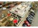 Aerial view of restaurant with outdoor patio seating, ample parking, and visible business signage at 2601 Boulder Way, Woodstock, GA 30188