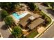 Scenic aerial view of the community pool and clubhouse, featuring landscaped grounds and convenient parking at 2601 Boulder Way, Woodstock, GA 30188