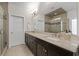 Bathroom with granite countertops, a large mirror, and modern fixtures for a spa-like experience at 2601 Boulder Way, Woodstock, GA 30188