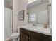 Bright bathroom featuring a modern vanity, a framed art piece, and a shower/tub at 2601 Boulder Way, Woodstock, GA 30188