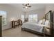 Bright bedroom featuring neutral walls, carpet, a ceiling fan and natural light at 2601 Boulder Way, Woodstock, GA 30188