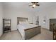 Bedroom featuring a gray wood bed frame, ceiling fan, and neutral walls at 2601 Boulder Way, Woodstock, GA 30188