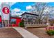 Exterior view of Reformation Brewery, featuring a red building with a silver silo and outdoor seating at 2601 Boulder Way, Woodstock, GA 30188