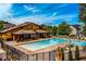 Community pool with clear blue water, numerous lounge chairs, and a covered pavilion for relaxing poolside at 2601 Boulder Way, Woodstock, GA 30188