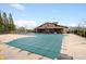 Community pool with a protective cover and plenty of surrounding space for residents to enjoy, shaded by tall trees at 2601 Boulder Way, Woodstock, GA 30188