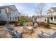 A large fire pit with chairs surrounding in a beautifully landscaped area at 2601 Boulder Way, Woodstock, GA 30188