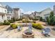 A fire pit with chairs surrounding in a beautifully landscaped area at 2601 Boulder Way, Woodstock, GA 30188