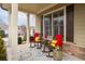 Cozy front porch with rocking chairs and a view of the neighborhood at 2601 Boulder Way, Woodstock, GA 30188