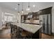 Kitchen with dark cabinets, a spacious island, granite countertops, and stainless steel appliances at 2601 Boulder Way, Woodstock, GA 30188